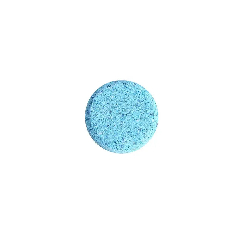 a blue bath bomb on a white background