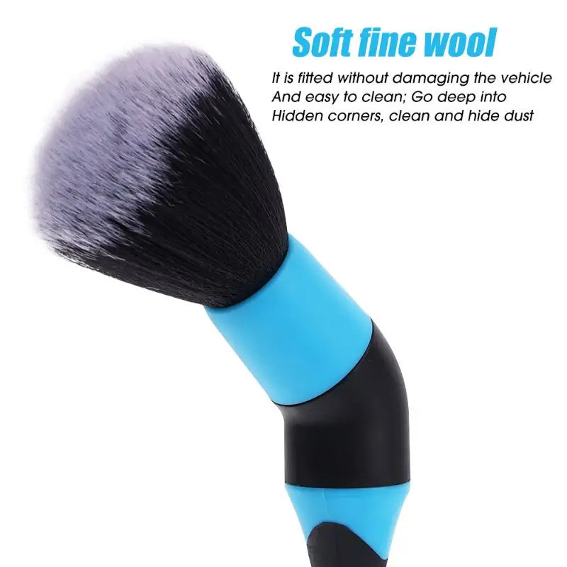 a blue and black brush with a black handle