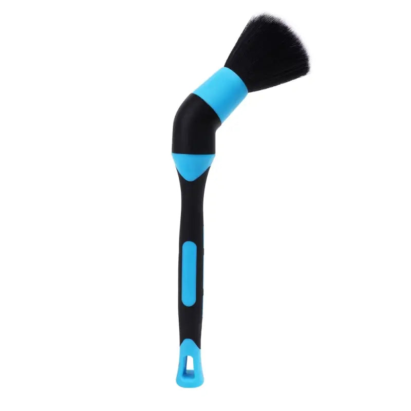 a blue and black brush with a black handle