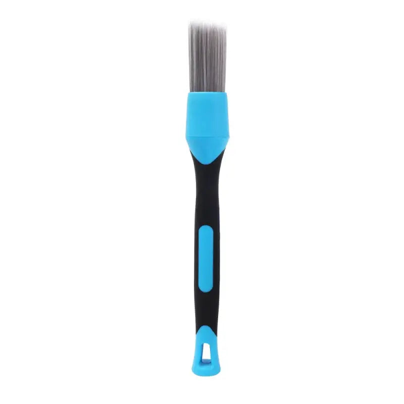 a blue and black brush with a handle