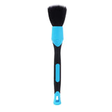 a blue and black brush with a black handle