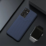 Blue and black carbon fiber pattern phone case with multiple camera cutouts.