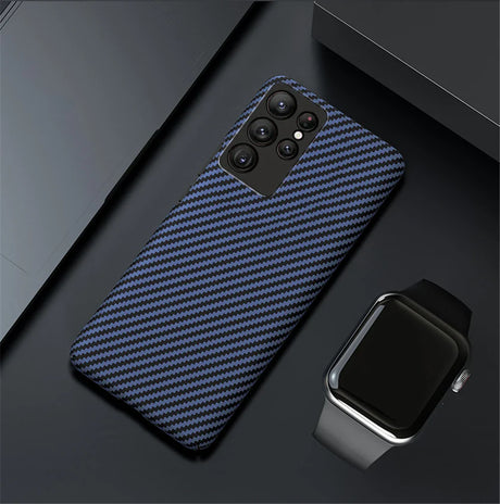 Blue and black carbon fiber pattern phone case with multiple camera cutouts.