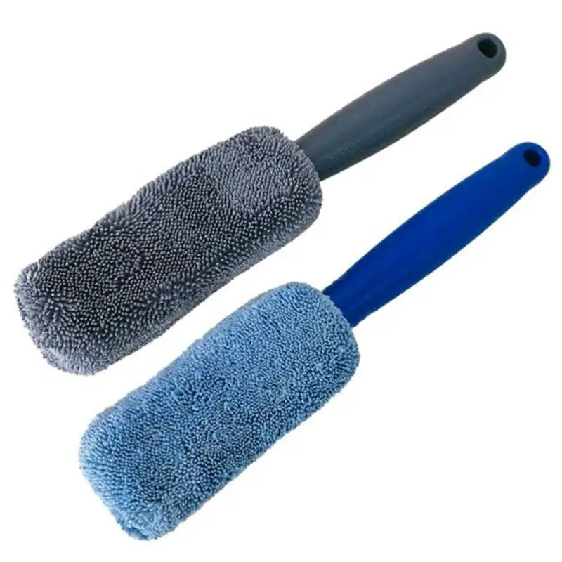 two blue brushes with a black handle