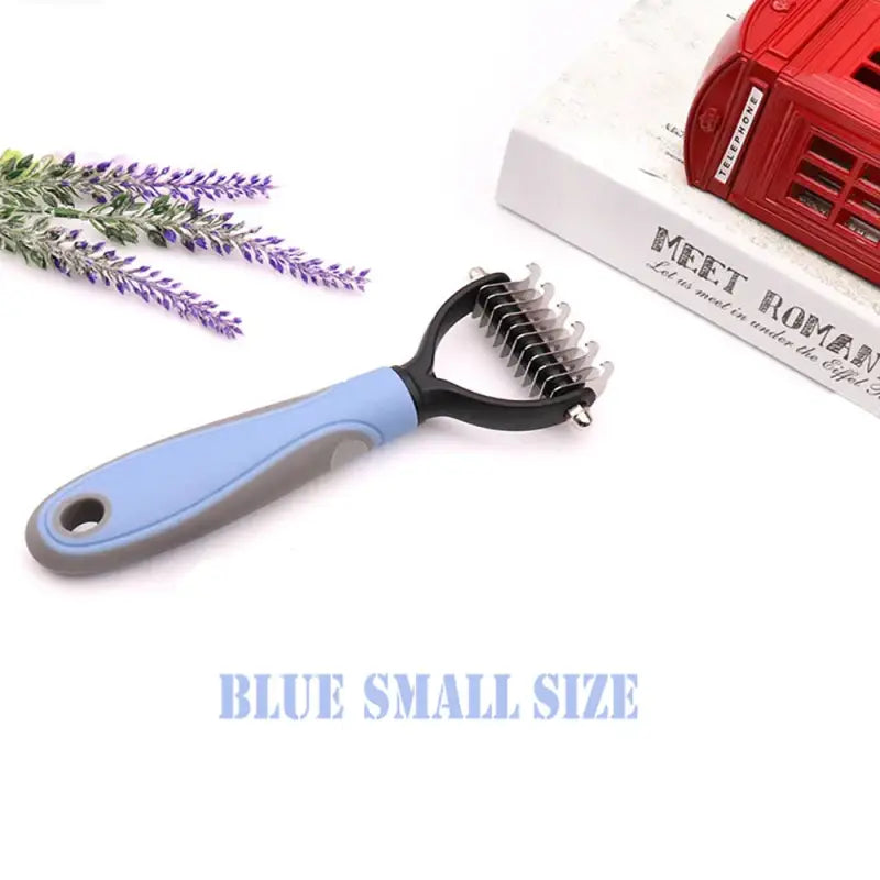 a blue and black hair brush with a red box