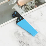 a blue and black knife on a marble counter