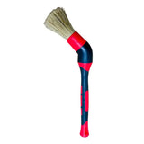 a red and blue brush with a black handle