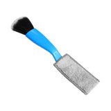 a blue brush with a black handle