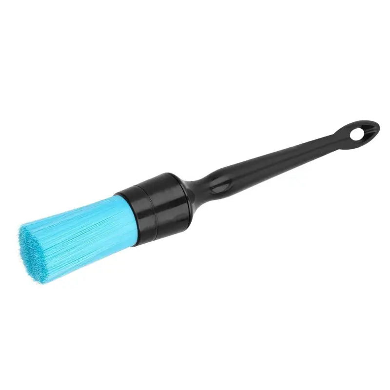 a blue brush with a black handle