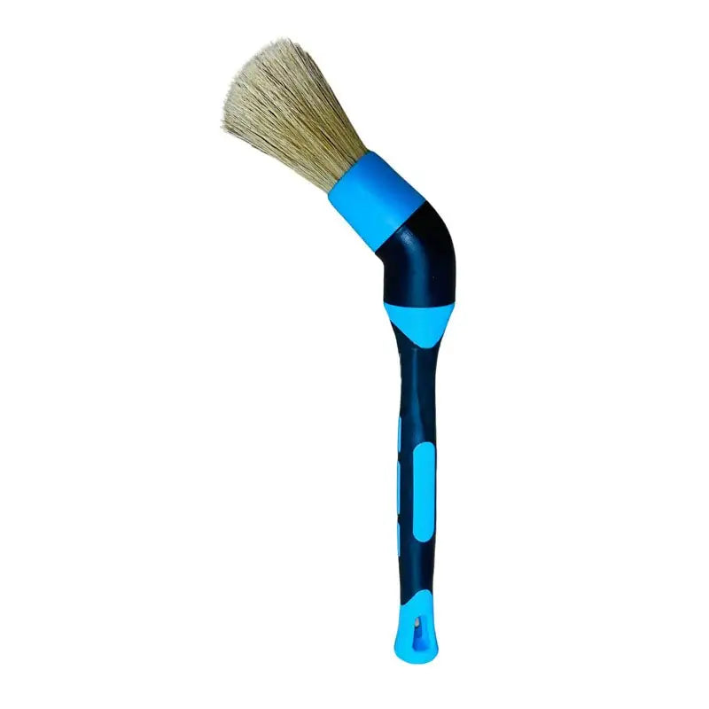 a blue brush with a white handle