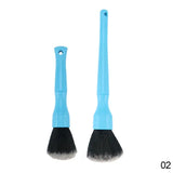 two brushes with a blue handle