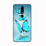 a blue butterfly flying over water with stars on the back