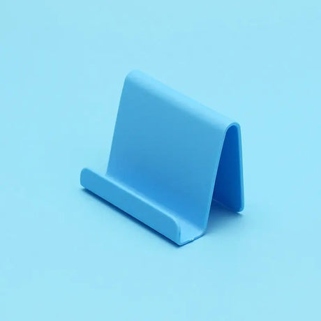 a blue paper holder on a blue background