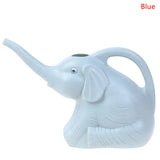 a small elephant shaped vase with a white background