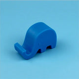 a blue elephant shaped object on a blue background