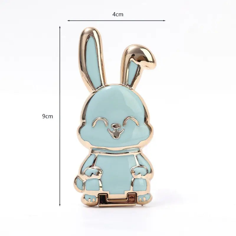 a blue enamel rabbit with a gold plated base