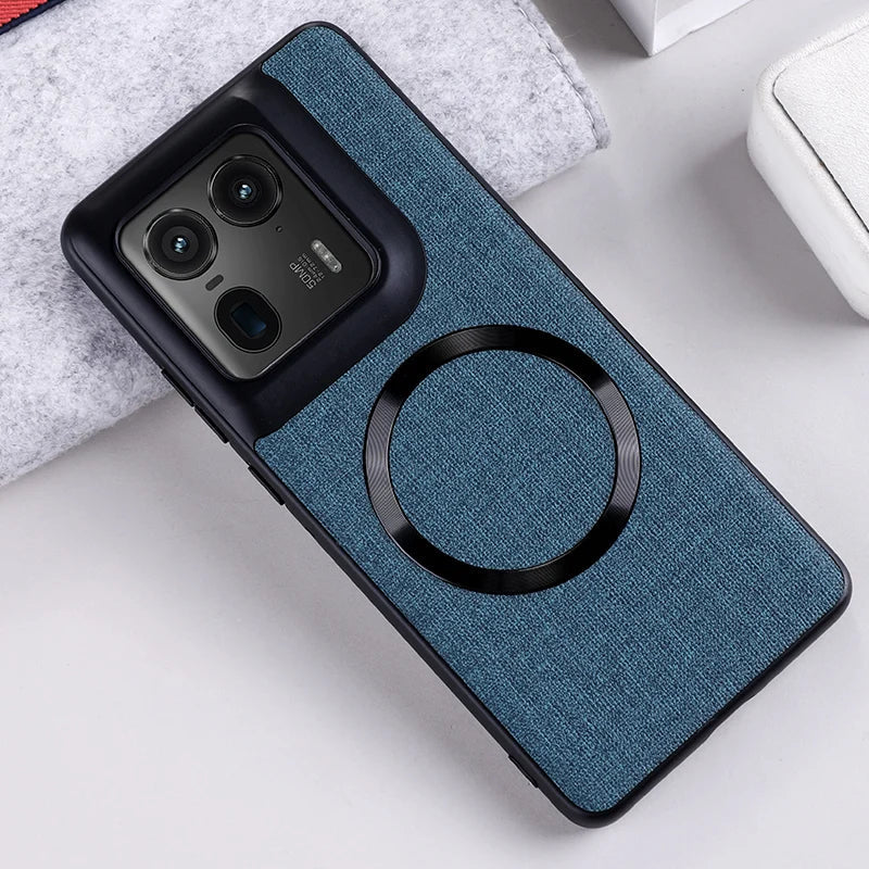 Blue fabric-textured phone case with a black camera module cutout and a circular magnetic ring.