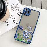 a blue flower phone case sitting on a table