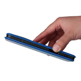 A blue folio case for a tablet or e-reader, held by a hand.