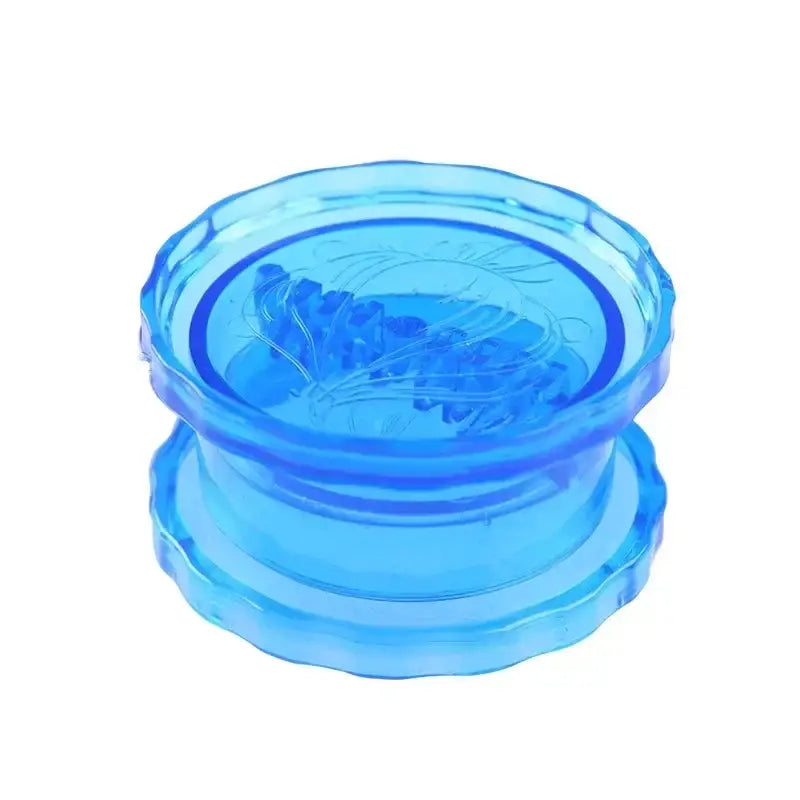 there is a blue glass bowl with a flower inside of it