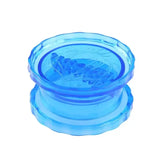 there is a blue glass bowl with a flower inside of it