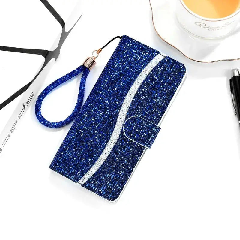 a blue glitter phone case with a white and black phone
