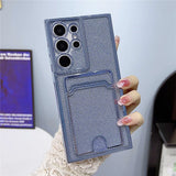 Blue glitter phone case with a camera protector and built-in card holder.