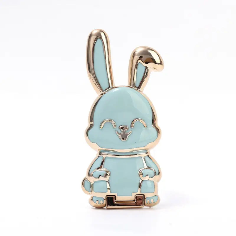 a blue enamel rabbit with a gold plated head