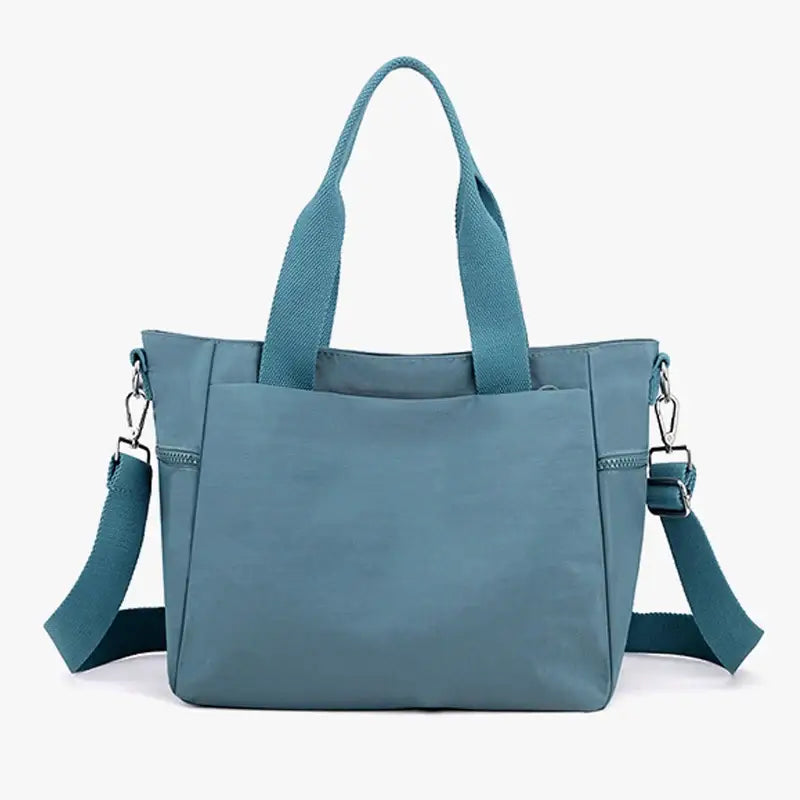 a blue handbag with a zipper closure