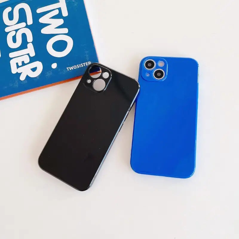 a blue iphone case next to a black iphone case