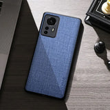 the back of a blue iphone case sitting on a desk