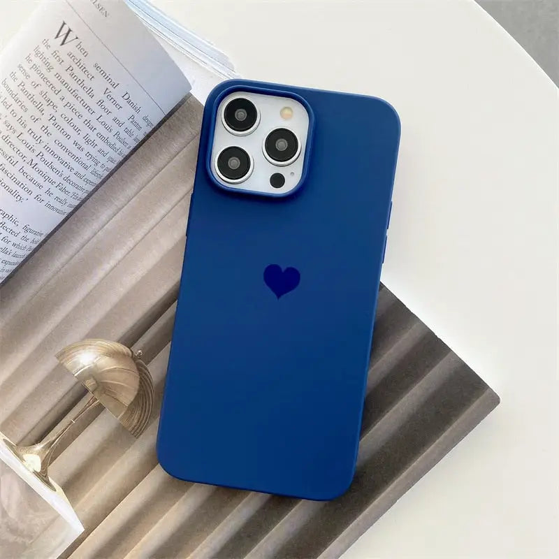 the blue iphone case is on a table