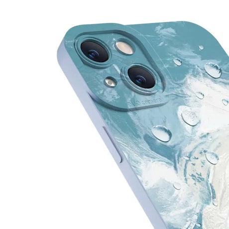 The back of a blue iphone case with water droplets