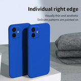 two blue iphone cases sitting on top of a white table
