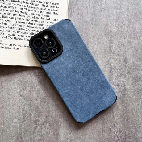 The back of a blue leather case with a book on it