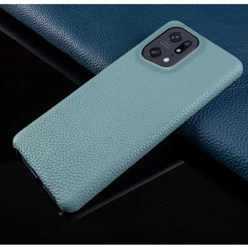 the back of a blue leather case