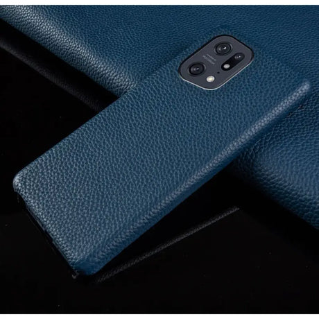 the back of a blue leather case