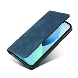 the back of a blue leather case with a phone in it