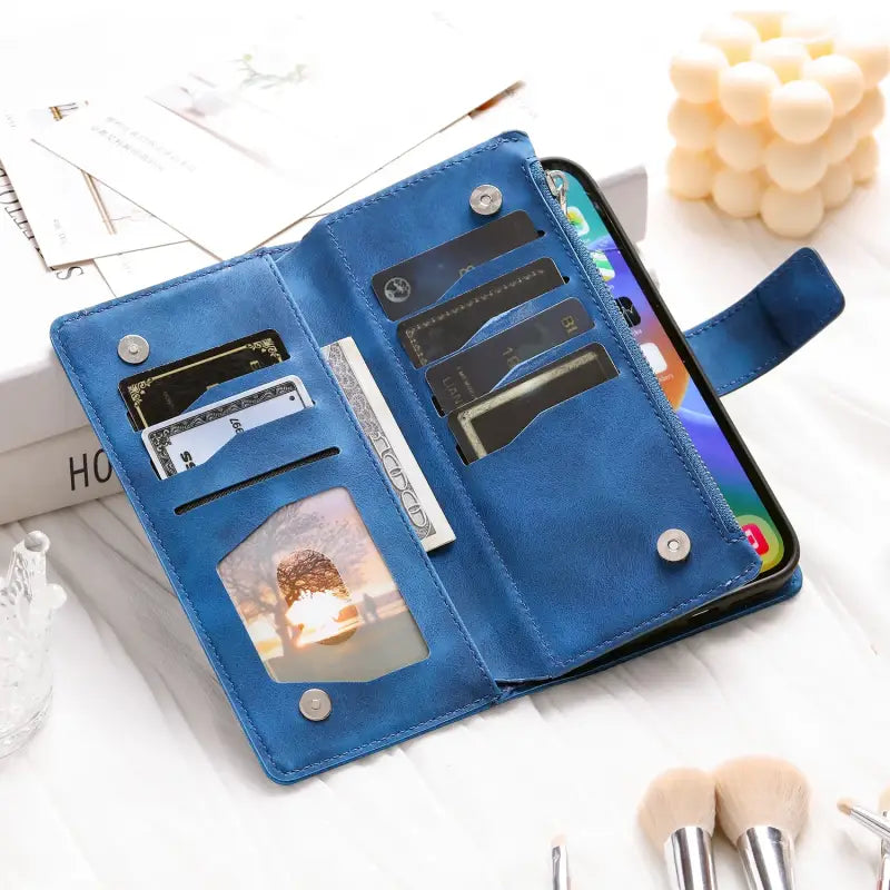 the blue leather wallet case is open and has a credit card slot