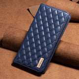 the blue leather wallet case is shown on a pile of brown cardboard