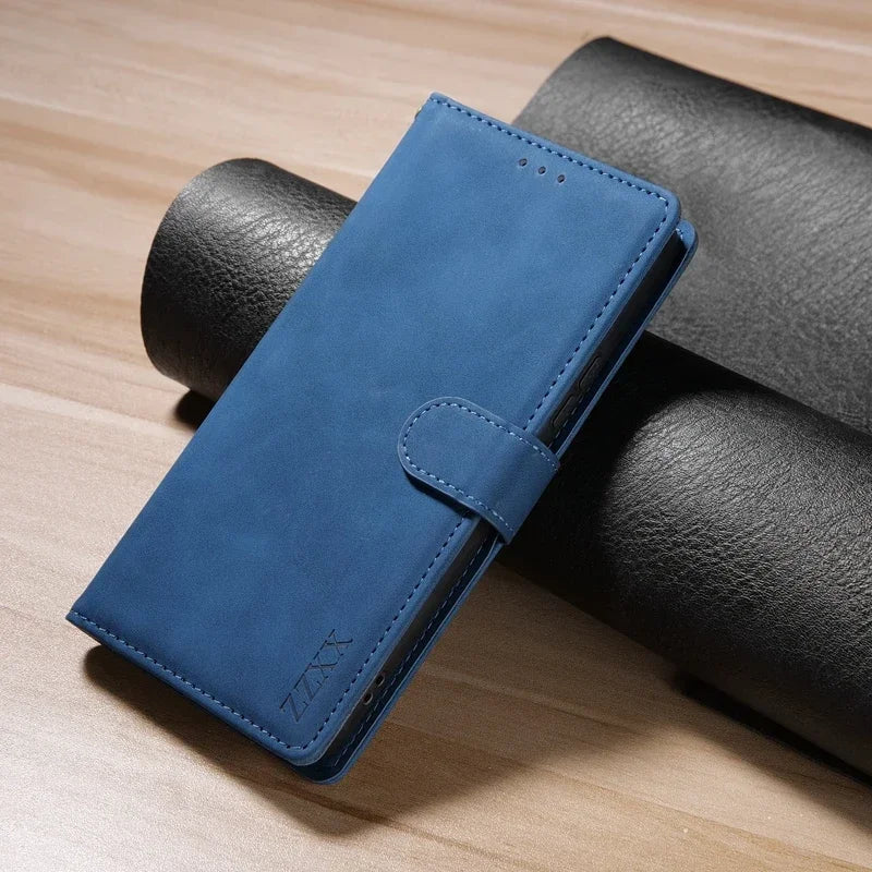 Blue leather wallet or phone case with a clasp closure.