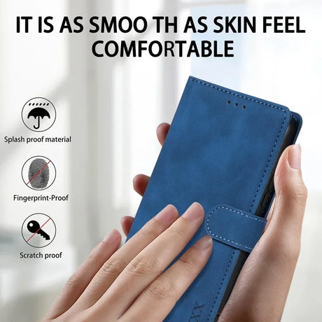 Blue leather wallet or phone case being held in a person’s hands.