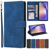 Blue leather wallet-style phone case with multiple card slots and a wrist strap.