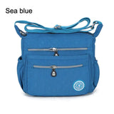 a blue bag with a zipper on the front