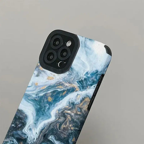 The blue marble iphone case is shown with the phone cover