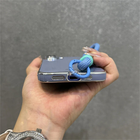 Blue phone case with lanyard.