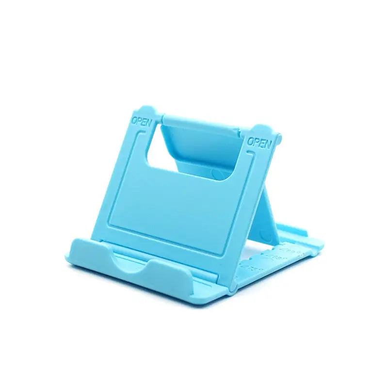a blue plastic phone stand with a white background