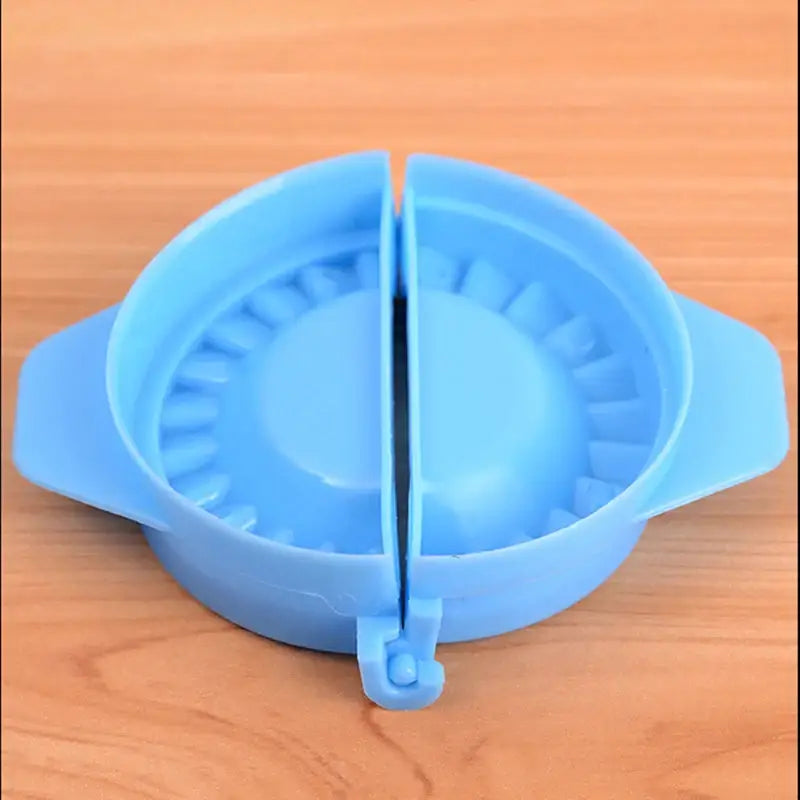 a blue plastic bowl with a hole in it