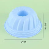 a blue plastic cake pan with a white base
