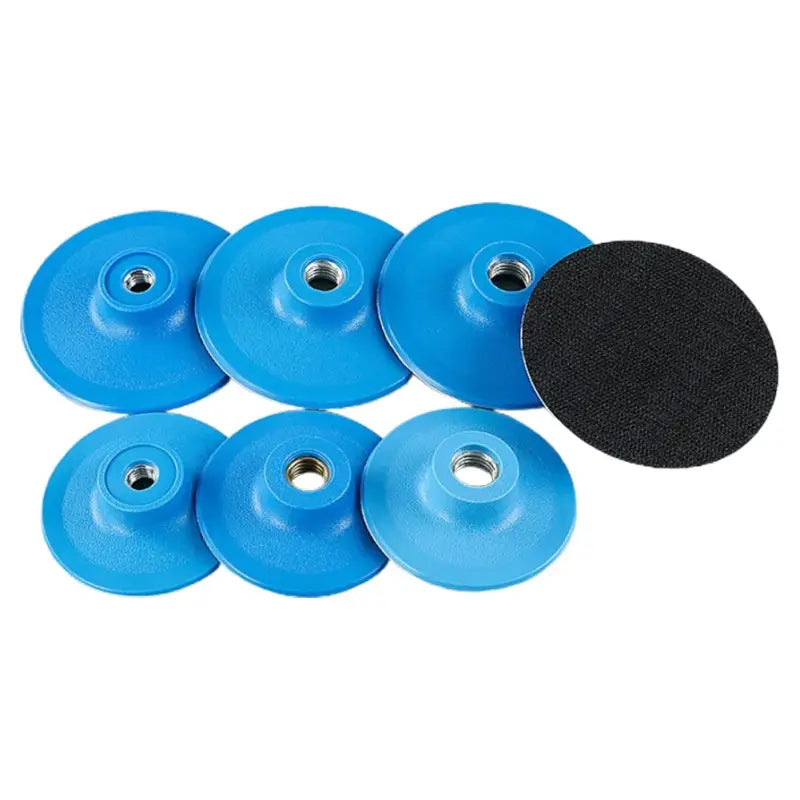 a set of blue polish pads with a black disc